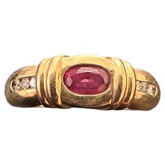 14k Yellow Gold ~ approx. 3mm x 4mm Oval Ruby with 6 side Diamonds three on each side, 5.8mm Wide Band Ring Size 6 The ruby is known as a protective stone that can bring happiness and passion into the life of the wearer. Apart from its red colour, this is why the ruby makes a perfect gift for a loved one for oneself. This exquisite ring is crafted from 14k yellow gold and features a stunning oval-shaped natural ruby as its centrepiece. The ruby is surrounded by six sparkling diamonds, three on each side that are channel set. The band is beautifully designed with a classic band style and fits perfectly on a size 6 finger. Perfect for any occasion, this ring is a true statement piece that will add a touch of elegance and sophistication to any outfit. 6 Fingers, Wide Band Ring, Diamonds Ring, Red Colour, Wide Band Rings, Channel Set, Bring Happiness, Natural Ruby, Wide Bands