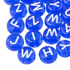 blue glass beads with white letters on them