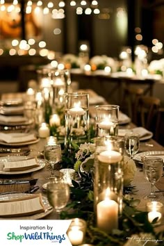 a long table is set with candles and place settings for an elegant dinner or party