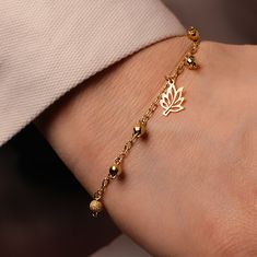 This leaf bracelet gold is a simple bracelet with a minimalist design. It consists of a delicate, dainty bracelet in gold vermeil (a high-quality layer of gold on 925 silver). The main element of the bracelet is the leaf and the four ball charms, which are evenly distributed along the bracelet. The charms are subtle and add a cute touch to the bracelet. Perfect as an autumn gift or Christmas gift. Material: solid 925 Sterling Silver plated with 4 microns of 24K Gold Vermeil Bracelet length: 18-1 Gold Dainty Rosary Bracelet, Delicate Gold Rosary Bracelet Gift, Delicate Adjustable Gold Charm Bracelet, Dainty Gold Plated Charm Bracelet With Delicate Chain, Delicate Gold-plated Charm Bracelet, Delicate Gold Charm Bracelet, Delicate Gold Plated Charm Bracelet, Minimalist Gold Rosary Bracelet Gift, Elegant Gold Hypoallergenic Rosary Bracelet