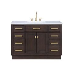 a bathroom vanity with two sinks and gold handles on the top, against a white background