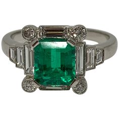 This beautiful and one of a kind natural luscious green emerald and diamond ring is wonderfully handcrafted in Platinum. Emerald weight : 1.40 carat Diamond weight : 0.74 carat Metal : Platinum Ring size : 6 1/2 Heirloom Emerald-cut Ring With Single Cut Diamonds, Heirloom Emerald Cut Ring With Single Cut Diamonds, Luxury Green Emerald Ring With Single Cut Diamonds, Fine Jewelry Green Emerald Ring With Single Cut Diamonds, Green Diamond Ring With Single Cut Emerald Shape, Green Emerald Cut Diamond Ring With Single Cut Diamonds, Luxury Green Diamond Ring In Platinum, Art Deco Green Ring, Gia Certified, Art Deco Green Ring Gia Certified