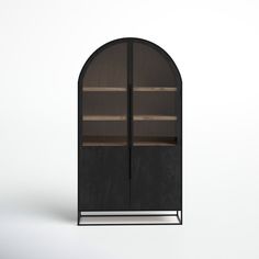 an arch shaped cabinet with glass doors on the front and bottom, in dark wood