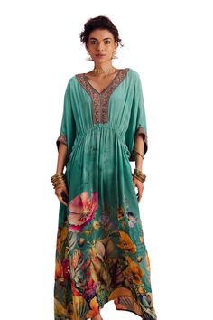 Green kimono sleeves maxi kaftan with botanic blossom print, beads hand embroidered V neckline, sleeves hem and gathered waist detailing with cowrie shell tassel tie-up. - Aza Fashions Bohemian Maxi Kaftan With Floral Print, Festive V-neck Maxi Dress With Floral Print, Bohemian Floral Print Floor-length Kaftan, Flowy Floral Print Maxi Kaftan, Bohemian Floor-length Floral Print Kaftan, Bohemian V-neck Kaftan With Printed Motifs, Bohemian Floor-length Kimono For Spring, Bohemian Silk Maxi Dress With Floral Embroidery, Festive Bohemian Kaftan With Floral Print