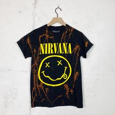 Brand: Nirvana Size: Small Condition: Brand New Without Tags Material: Cotton Color: Black/Yellow/Orange Fit: Nirvana Band Tee, Bleached Band Tee, Band Shirt, Music, Splatter Flaws: None Yellow Graphic Print Band Merch Top, Edgy Cotton Tops For Festival, Yellow Grunge Tops For Summer, Yellow Grunge Top For Summer, Yellow Grunge Tops For Streetwear, Yellow Short Sleeve Grunge Tops, Yellow Band Merch Tops For Streetwear, Yellow Short Sleeve Grunge T-shirt, Yellow Crew Neck Grunge T-shirt