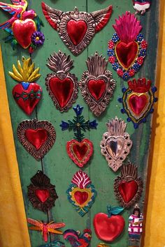 a door decorated with lots of different heart shaped decorations on it's front and side