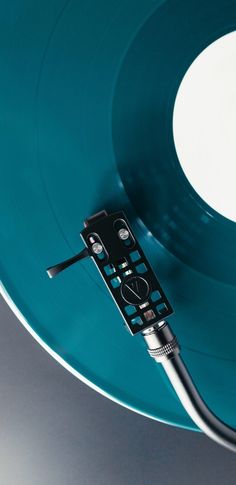 a remote control sitting on top of a blue record