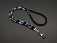 Introducing our Handmade Ethnic Boho Lanyard, a one-of-a-kind Native American inspired Beaded ID Holder. This exquisite piece showcases exceptional craftsmanship and attention to detail. Each lanyard is meticulously crafted using vibrant seed beads, resulting in a stunning accessory that radiates beauty and heritage.  Highlights: - Handmade with love and passion, this lanyard embodies the essence of creativity and individuality. - The list of materials includes premium TOHO beads, Japanese beads Blue Beaded Lanyard, Indigenous Beaded Lanyard, Seed Bead Lanyard, Bead Lanyard, Diy Lanyard, Native American Beadwork Patterns, Card Necklace, Native American Artwork, Beaded Lanyard