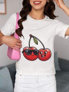 Step up your style game with our unique "Fun Cherry Sunglasses" T-shirt. Perfect for both men and women, this tee brings a dash of humor with its playful cherry characters donning cool sunglasses. Made from high-quality, soft fabric, it ensures comfort all day long. Whether you're out for a casual meet-up or a fun party, this shirt is sure to catch some eyes and spark smiles. Ideal for fruit lovers and those who appreciate a good laugh, it makes an excellent gift for various occasions. Pair it with your favorite jeans for a laid-back look or layer it under a jacket for cooler days. We utilize the authentic Bella Canvas 3001 brand, renowned for its UNISEX design, making it one of the most sought-after shirts in the market. Prior to placing an order, kindly refer to our size chart. It can be White Cotton Sublimation T-shirt With Funny Print, Cool White T-shirt With Funny Print, Trendy T-shirt With Funny Print For Fans, Trendy Fan Merchandise T-shirt With Front Print, Trendy T-shirt For Fan Merchandise With Front Print, Trendy T-shirt With Front Print For Fan Merchandise, Trendy T-shirt With Front Print For Fans, Funny Sublimation Print Crew Neck Top, Funny Print Crew Neck Top For Fans