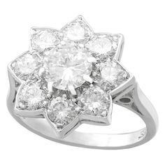 A stunning vintage 1940s 1.87 carat diamond and 18 karat white gold, platinum set floral cluster ring; part of our diverse diamond jewelry and estate jewelry collections. This stunning, fine and impressive vintage diamond ring has been crafted in 18k white gold with a platinum setting. The platinum set floral cluster design is ornamented with a central feature 0.82 Ct transitional modern brilliant round cut diamond, eight claw set in subtle relief. The feature diamond is surrounded by eight 'pet Luxury Timeless Cluster Diamond Ring, Luxury Diamond White Cluster Ring With Emerald Cut, Luxury Collectible Cluster Ring With Prong Setting, Luxury Cluster Diamond Ring, Fine Jewelry Style, Luxury White Gold Cluster Ring With Rose Cut Diamonds, Luxury Cluster Diamond Ring With Accent Stones, Resetting Diamond Cluster Ring, Luxury Art Deco Cluster Ring With Diamond Accents, Luxury Antique Diamond Cluster Ring