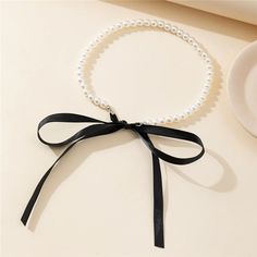 Trend Wedding Party Jewelry Long Black Ribbon Choker Necklace For Women Elegant White Imitation Pearl Beach Vacation Necklaces Necklace Type: Chains Necklaces Material: PEARL Pearl Type: Simulated-pearl Gender: Women Model Number: r6r Style: TRENDY Shape\pattern: Round Fine or Fashion: fashion Occasion: Anniversary Item Type: NECKLACES Compatibility: All Compatible Choice: yes semi_Choice: yes Black Ribbon Choker Necklace, Black Ribbon Choker, Ribbon Choker Necklace, Ribbon Choker, Pearl Beach, Trending Necklaces, Bow Necklace, Wedding Party Jewelry, Chains Necklaces