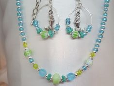 "Blue Beaded Necklace *FREE SHIPPING*/Silver Jewelry Unique Silver, Blue, Sea foam Green, Choker with Czech Glass Beads. This beach inspired Choker are sure to be a hit this summer with you or as a great thoughtful gift! The choker will fit necks from 13\" inches up to 16\" inches. Length of the choker 13\" to 15\" inches, allowing chain dangle on end, depending on where you hook the clasp on the extension chain. Hypoallergenic to eliminate irritation/ Excellent customer reviews/Handmade in the Handmade Silver Beaded Necklaces For Summer, Ocean-inspired Beaded Necklaces For Summer Gift, Blue Jewelry With Silver Beads For The Beach, Handmade Silver Beaded Necklace For Summer, Blue Jewelry With Silver Beads For Summer, Blue Round Beads Jewelry For Beach Season, Blue Jewelry With Lobster Clasp For Summer, Turquoise Jewelry With Spacer Beads For Summer, Summer Silver Jewelry With Colorful Beads