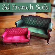 two miniature couches sitting next to each other on top of a wooden table with the words 3d french sofa