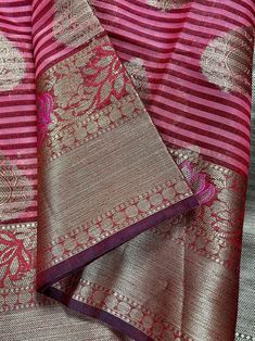 Gorgeous Maheshwari handloom Saree in Silk Cotton soft material with Meenakari Work. Borders have Black as well. Body of the saree has Zari Buttas.  Simple and Elegant - Style it will any traditional jewelry  Item: Saree Color : Wine and Mauve Pink  Base Fabric: Maheshwari  Cotton Silk . Super soft & Light material.  Blouse piece : Comes with Blouse piece. Blouse material: Maheshwari Cotton Silk  Work: Zari Weaving and tassels attached  Fall & Edging:  Come with Fall and edging (Pico) Disclaimer -: - Color variation is possible due to various reasons like phone or desktop setting, resolution etc. Please don't hold us responsible. Our aim is to put the exact color of the Saree. - If the Saree is Pure Silk, we will put it very clearly in our listing that it is Pure Silk. If we do not mention Handloom Chanderi Saree For Celebration, Multicolor Slub Silk Traditional Wear With Zari Weaving, Navratri Slub Silk Saree With Weaving Work, Handloom Tussar Silk Saree For Celebration, Slub Silk Saree With Weaving Work For Puja, Tussar Silk Handloom Saree For Celebration, Celebration Chanderi Saree With Zari Weaving, Handloom Traditional Wear For Navratri Celebration, Navratri Celebration Handloom Traditional Wear