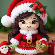 a crocheted doll is holding a christmas present