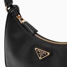 Black Saffiano print leather shoulder bag from Prada featuring an adjustable top handle, a top zip fastening, a leather luggage tag, a metal logo plaque stitched on the front and gold-tone metal hardware. Size Type: INTMaterial: LeatherSKU: 1BC204JOMNZV/P_PRADA-F0632_100 Our Products Are 100% Genuine. In All Cases We Stand By The Authenticity Of Every Product Sold On Our Site. Luxury Business Bags With Logo Plaque, Saffiano Leather Shoulder Bag, Classic Saffiano Leather Shoulder Bag With Branded Hardware, Black Saffiano Leather Shoulder Bag With Adjustable Strap, Luxury Shoulder Bag With Logo Plaque For Business, Luxury Bags With Logo Plaque For Everyday Use, Rectangular Travel Bag With Logo Plaque, Saffiano Leather Shoulder Bag With Branded Hardware, Designer Saffiano Leather Shoulder Bag For Office