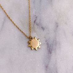 Our new 14K gold ‘Sun- Rise Necklace’ is a reminder that storms don’t last forever, the sun always rises and so will you.The sun is a daily reminder that we too can rise again from the darkness and makes the perfect gift for yourself or someone you love who could use some encouragement and sunshine to keep thriving. This meaningful piece is 100% solid gold and is perfect for layering or worn on its own. It has an adjustable chain at 16 and 18 inches. Even More Reasons to Feel Good About Your Pur Gold Sun Jewelry, Celestial Sterling Silver Necklace With Sun Design, Minimalist Sterling Silver Jewelry With Sun Design, 14k Gold Sun And Moon Pendant Necklace, 14k Gold Pendant Necklaces With Sun And Moon Design, Everyday Yellow Gold Sun And Moon Necklace, 14k Yellow Gold Sun Design Necklace, Celestial Yellow Gold Charm Necklaces For Everyday, Celestial Yellow Gold Charm Necklaces