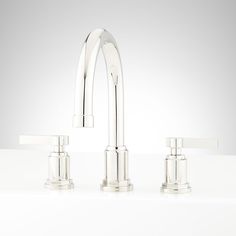 three faucets with two handles and one handle on each side, all in polished chrome