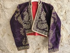 Antique Turkish Jacket,Golden glitter Embroidery,Purple Velvet, Antique Ottoman Embroidered Velvet Waistcoat!1468 a very rare masterpiece, Anatolian velvet jacket circa 1850. Size:40x40 cm & 15x15 inchew Size:S/M (for more details, don't hesitate to contact me) Material: textile product is 100% velvet, Gold embroidery . Washing instructions: hand wash, cold wate Condition : good condition. **In addition, bulk purchases and interior designer and home decoration and special discounts are made. Ple Embroidered Long Sleeve Outerwear For Costume, Embroidered Long Sleeve Purple Outerwear, Embroidered Purple Long Sleeve Outerwear, Purple Embroidered Long Sleeve Outerwear, Purple Long Sleeve Embroidered Outerwear, Glitter Embroidery, Velvet Waistcoat, Purple Vests, Antique Ottoman