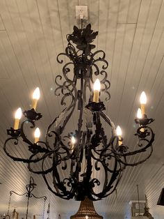 a chandelier hanging from the ceiling in a room