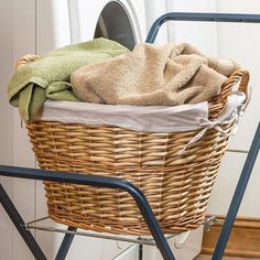 a laundry basket sitting on top of a metal rack