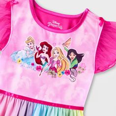 Your child will be ready for magical dreamland adventures in this Disney Princess Dress-Up Nightgown. Made from lightweight fabric, this cap-sleeve nightgown offers them all-night comfort, while the pullover style makes it easy to wear. Designed in a pink hue, it features a graphic showing Cinderella, Ariel, Rapunzel and Mulan. Plus, the rainbow skirt and flutter sleeves lend it an extra sweet flair. Disney Princess Dress Up, Princess Nightgowns, Rainbow Skirt, Girls Nightgown, All Disney Princesses, Princess Dress Up, Disney Princess Dresses, Pajama Dress, Disney Frozen Elsa