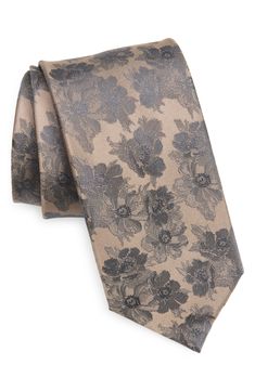 Jacquard-woven flora bring texture and distinction to this handsome silk tie that complements any tailored look. 3" width; 57" length 100% silk Dry clean Imported Elegant Floral Print Accessories For Black Tie, Classic Formal Ties With Floral Print, Elegant Floral Print Suit And Tie Accessories For Wedding, Elegant Patterned Tie With Floral Print, Elegant Patterned Ties For Formal Occasions, Elegant Patterned Ties For Semi-formal Occasions, Elegant Formal Patterned Ties, Black Floral Tie, Burgundy Tie