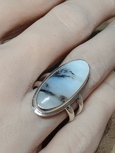 One of a kind, handcrafted, Scenic Peruvian Opal and sterling silver ring.  Size 7.5(one free sizing). Top measures about 29mm X 13mm. Handmade Sterling Silver Opal Ring, Handmade Artisan Opal Ring In Sterling Silver, Unique Handmade Silver Opal Ring, Handmade Unique Sterling Silver Opal Ring, Artisan Handmade Opal Ring For Anniversary, Handmade Unique Silver Opal Ring, Artisan Oval Opal Ring Gift, Handmade Artisan Opal Ring For Anniversary, Silver Handmade Opal Ring Collectible