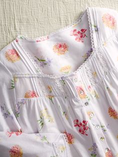 Beautiful blooms set against a buttery pin-dot ground highlight this supremely soft cotton nightgown. The smooth and silky knit gown has gentle gathers at the bodice to ensure a loose fit—one that won't cling, bind, or pinch Cotton Nightgown With Lace Trim Long Sleeve, Long Sleeve Cotton Nightgown With Lace Trim, Cotton Long Sleeve Nightgown With Lace Trim, Feminine Long Sleeve Cotton Nightgown, Spring Cotton Chemise For Bedtime, Feminine Cotton Nightgown For Pajama Party, Spring Sleepwear With 3/4 Sleeves, Summer Long Sleeve Nightgown With Lace Trim, Summer Long Sleeve Lace Trim Nightgown