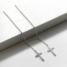 One pair of high quality sterling silver Cross threader earrings. Lightweight and easy to wear, from day to night - they are effortlessly stylish, giving you a up to date and feminine look. Simple yet striking, these fine chain Threader Earrings look stunning on. Just push in and gently pull through. Threader earrings are worn with part of the chain hanging behind the earlobe and the remainder hanging in front. The ultimate in minimalist earrings 💕Details Cross: 7 mm wide Length: approx 60 mm 💕 Online store: www.thejewellerytree.net 💕 Stay up-to-date with new designs & special offers  - FOLLOW ME   Socials: @myjewellerytree OR  https://www.facebook.com/thejewellerytree1/  💕 Need more info, feel free to email - I'd love to help 💕And please visit my store https://www.etsy.com/au/shop/Th Minimalist Silver Linear Earrings For Pierced Ears, Classic Silver Threader Earrings As Gift, Minimalist Hypoallergenic Silver Linear Earrings, Simple Silver Sterling Threader Earrings, Simple Silver Threader Earrings As Gift, Silver Minimalist Threader Drop Earrings, Silver Minimalist Threader Earrings, Minimalist Sterling Silver Threader Earrings For Gift, Silver Threader Earrings For Everyday