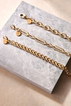 The Esmé bracelet is made from our thick chopin chain and fastened with a with lobster clasp. Material: Recycled Brass Plating: 14K Gold or Rhodium-silver Chain has a clear protective coating to prevent from quick wear and tarnishing. Chain measures: 7mm wide Clasp Measures: 15mm Available in the following Lengths: 6.5", 7", 8", 8.5", 9" Bracelet is handmade in the USA Timeless Chunky Chain Bracelet For Everyday, Timeless Everyday Chunky Chain Bracelet, Timeless Chain Link Bracelet With Lobster Clasp, Minimalist Gold-tone Chunky Chain Bracelet, Classic Tarnish-resistant Chain Link Bracelet, Timeless Link Bracelets With Chunky Chain, Timeless Chunky Link Chain Bracelet, Gold Link Chain Bracelet With Lobster Clasp, Classic Gold Cable Chain Link Bracelet