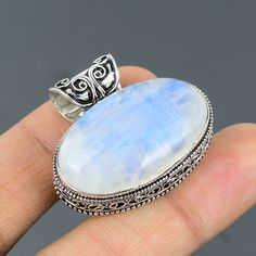 Note: Due to the natural formation of this gemstone. Slight variation in design and color are to be expected. Rainbow Moonstone Pendant 925 Sterling Silver Pendant Handmade Ethnic Jewelry Real Gemstone Pendant Anniversary Gift For Mom Vintage Pendant SKU  : VP-312 Handmade Pendant Gemstone :  Rainbow Moonstone Stone Shape : Oval Metal Purity : 925 Sterling Silver Pendant Length : 33 MM Pendant Width : 38 MM Rainbow moonstone is thought to bring balance, harmony and hope while enhancing creativit Handmade Silver Moonstone Gemstones, Bohemian Jewelry With Large Moonstone, Bohemian Moonstone Jewelry With Large Stone, Bohemian Silver Jewelry With Large Stone, Artisan White Jewelry Stamped 925, Bohemian Moonstone Cabochon Jewelry, Silver Moonstone Pendant Gemstones, Bohemian Sterling Silver Gemstones, Natural Silver Moonstone Gemstones