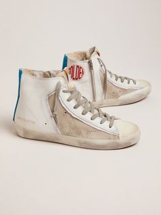 We take our idea of style to a new level with our sneakers. We tell stories, highlighting the uniqueness of each one of us. These limited edition Francy sneakers feature a smooth and suede leather upper, perforated star and blue stripe on the back. White Suede High-top Sneakers, White Suede High-top Sneakers With Perforated Toe Box, White Suede High-top Sneakers With Perforated Toe, Designer White Suede Sneakers, Custom White High-top Suede Sneakers, Designer High-top Sneakers With Perforations, White Suede High-top Sneakers With Vulcanized Sole, Leather Street Style, The Golden Goose