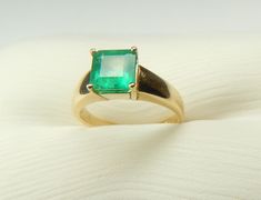 "Colombian Emerald Ring Set in 14K Gold 1 Natural Emerald Cut Emerald / Size ~ 1.65 Carats Color ~ Medium Green / Clarity ~ Type 3 Metal Purity ~ 14k Yellow Solid Gold / Weight ~ 3.66 Grams Precious ~ Classic ~ Timeless Finger (7 1/4 ) U.S.A and Canada (Sizable) Inquire about sizing cost ( 0 ) United Kingdom, Ireland, Australia, New Zealand ( - ) India, China, Japan, South America (15 ) Italy,Spain,Netherlands,Switzerland Measurements Inside Diameter ~ 17.53 mm - 0.69 Inches Inside Circumference Classic Solitaire Gemstones For Formal Occasions, Classic Solitaire Gemstones For Anniversary, Classic Gold Emerald Ring Gia Certified, Classic Yellow Gold Brilliant Cut Gemstones, Classic Emerald Gemstones For Anniversary, Classic Yellow Gold Round Cut Gemstones, Classic Emerald Cut Gold Gemstones, Emerald Cut Gemstones For Anniversary, Emerald Cut Yellow Gold Gemstone For Anniversary