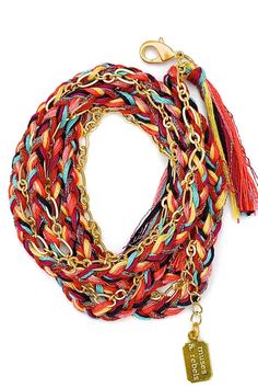 A satin gold plated link chain woven into a 100% cotton & metallic polyester thread braid with thread tassels at each end. The braid colors are red, maroon, rust, mauve, corn, aqua, black & multi metallic. The closure is a satin gold-plated trigger clasp. The total length of the chain is 28.5" (including 2 1/4" extension for size adjustability). This style can be worn as a wrap bracelet, necklace or anklet. The chain wraps approximately 4 times around the wrist (depending on wrist size). Red Bohemian Woven Braided Bracelets, Bohemian Red Woven Braided Bracelets, Bohemian Red Woven Braided Bracelet, Red Braided Bohemian Jewelry, Gold Woven Braided Bracelets For Festival, Braid With Thread, Braid Colors, Fringe Bracelet, Thread Tassels