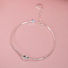 This beautifully crafted bracelet showcases two linked bangle pieces, complete with an adjustable chain and a charming heart-shaped charm. Made of high-quality 925 sterling silver, it makes for an exceptional Valentine's gift for your special someone. Treat your loved one to a piece of jewelry that is as stunning as it is meaningful. The Solid silver Valentine heart half bangle bracelet is a symbol of your love, beautifully crafted from 925 sterling silver and complete with an adjustable chain f Heart Shape Bracelet, Plate Jewelry, Heart Bangle Bracelet, Chain Heart, For Your Love, Valentine's Gift, Silver Bangle Bracelets, Valentine Gift, Bracelet Silver