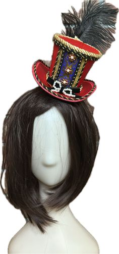 Classic Royal Nutcracker Top Hat Add elegant character to your Nutcracker shoots with the handmade Classic Royal Nutcracker Top Hat by The Head Mistress. A red satin top hat embellished with metallic jacquard trim, twisted satin rope, rhinestone buttons and embellishments and a velvet bow. A perfect addition to your nutcracker photo shoots! This lightweight top hat is fixed to a clip and fits all ages. Made in the USA Red Tall Crown Costume Hat For Party, Red Carnival Costume Hats And Headpieces For Party, Red Carnival Party Costume Hats And Headpieces, Adjustable Red Hat For Carnival, Red Adjustable Hat For Costume Party, Adjustable Red Hat For Costume Party, Fitted Red Costume Hats And Headpieces For Festival, Red Fitted Costume Hats And Headpieces For Festivals, Red Hats For Carnival Costume Party