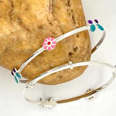 Handmade 925 Sterling Silver Adjustable Baby Bangle With Butterfly-Flower Enamel . Adjustable Baby Bangle Bracelet. Sterling Silver Baby Girl Jewelry ------------------------------------- Details: 6 inch adjustable baby bangle bracelet. 4.4 gram. Please measure the wrist size of your baby/toddler with a thread. There could be a fluctuation in the Dimensions. ------------------------------------- Do Visit our Shop for more jewelry: https://www.etsy.com/shop/InsiaJewelry -------------------------- Playful Handmade Silver Jewelry, Playful Silver Bracelets For Birthday, Adjustable Sterling Silver Bracelet For Birthday, Playful Silver Bracelets For Gifts, Playful Handmade Silver Bracelets, Playful Silver Jewelry For Birthdays, Playful Silver Jewelry For Birthday, Playful Nickel-free Silver Bracelets, Playful Silver Nickel-free Bracelets