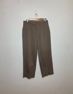 Vintage 1944 US Army Officers trousers. Awsome high waist and wide leg. Dated in the tag on the inner pocket. A few stains pictured but otherwise amazing condition. Such a sweet pair of pants. Tagged size 34, fits pretty much to size. I wear a 34 and these fit bit but there's not much extra space. Waist : 32" Rise : 15" Inseam : 25" Leg Opening : 10" Retro Wide-leg Pants With Pockets, Retro Straight Pants For Work, Retro Wide Leg Solid Bottoms, Fall Vintage Wide Leg Pants, Retro Straight Work Pants, Vintage Straight Pants With Pockets, Vintage Spring Workwear Bottoms, Vintage Straight Bottoms With Pockets, Retro Wide Leg Solid Color Pants