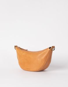 Say hello to Leo, the slouchy leather bag that fits all that you need for a busy day in town. Think of Leo as the cool sibling of our more structured Laura bag. Leo can be worn across the body as a bum bag, or on the shoulder as chic arm candy. Leo is unisex, catering to everyone who embraces that bumbag style. Leo comes in our wild oak soft grain leather, that timeless addition to any outfit. Do you want to wear Leo as a longer cross-body bag? Make sure to also add this strap to your cart. OMB- Style Rules, Sustainable Leather, Antique Brass Hardware, Bum Bag, Arm Candy, The Gap, Body Bag, Leather Crossbody Bag, Say Hello