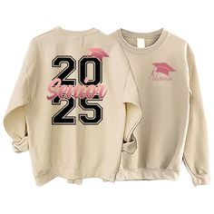 two white sweatshirts with pink and black letters on them, one has the number twenty