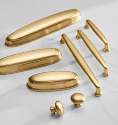 an assortment of gold handles and knobs