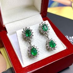 ONE OF A KIND HANDCRAFTED EARRINGS. IN STOCK! READY FOR SHIPPING! GIFT WRAP AVAILABLE! FREE UPS EXPRESS! STUNNING 5.32TCW, Certified Zambian Emerald earrings. UNIQUE DESIGN! ONE OF A KIND! LUXURIOUS, LARGE, SPARKLING EMERALDS IN PAIR! Extremely rare! Surrounded by TOP GRADE, F/VS DIAMONDS! Set in 18K solid white gold earrings. These earrings will absolutely dazzle anyone who sees them! Our jewelry are specially designed, and are delicately handcrafted by local, professional goldsmiths, who have Gia Certified White Gold Teardrop Earrings, Pear-shaped Gia Certified White Gold Earrings, Gia Certified Pear Shaped White Gold Earrings, White Gold Teardrop Chandelier Earrings With Prong Setting, White Gold Pear-shaped Chandelier Earrings, Gia Certified Sterling Silver Teardrop Earrings, White Gold Teardrop Chandelier Earrings As Gift, White Gold Teardrop Chandelier Earrings For Gifts, Gia Certified Teardrop Sterling Silver Earrings