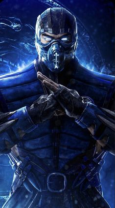 an image of a man in blue armor holding his hands up to his chest and looking at the camera