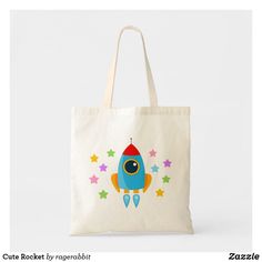 a tote bag with a cartoon rocket ship on it