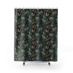 a shower curtain with an image of leaves and butterflies on the outside, against a white background