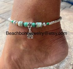 This beautiful beach ankle bracelet for women is made with green stone beads, white and green shell beads, silver Tibetan beads, a silver flip flop charm, and silver glass beads. Don't like the flip flop charm? I have several to choose from. Just message me your preference and I'll see what I can do for you! Ankle bracelet comes in several sizes, just choose your size from the drop down menu at checkout. Don't see your size? Just message me and I'll be happy to make your size for you! Bohemian Round Beads Anklets For Beach, Silver Anklets With Tiny Beads For Beach, Silver Bohemian Strand Anklets, Bohemian Anklets With Round Beads For Beach Season, Bohemian Green Anklets With Tiny Beads, Silver Strand Anklets For Beach Season, Beaded Beachy Anklets For Gift, Beaded Anklets For Beach Season Gift, Beaded Anklets As Beach Season Gift