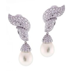 A dramatic pearl drop earring featuring 14 X13mm and 7 ¾ carats of shimmering brilliant diamonds, set in platinum. The earring boast 184 brilliant diamonds weighing approximately 6 carats. The drops are comprised of 66 diamonds weighing 1.74 carats Platinum Earrings, Fancy Makeup, Pearl And Diamond Earrings, Sea Pearl, South Sea Pearls, Sea Pearls, Fine Jewels, Antique Earrings, Pearl Diamond