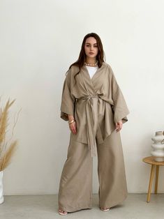 🌿Linen women kimono set with jacket and trousers. You can wear this stylish kimono at home or on the walk, apply kimono, as a cardigan, summer cloak. MORE: https://www.etsy.com/shop/ArtVyshyvankaUA?ref=seller-platform-mcnav%C2%A7ion_id&section_id=38397051 Fabric:  linen ----------------------------------------------------------------------------------------------------- Delivery time after shipping: USA 2-5 weeks Canada 4-6 weeks UK 3-5 weeks EU 2-4 weeks --------------------------------------- Luxury Cream Long Sleeve Kimono, Spring Workwear Kimono With Kimono Sleeves, Spring Workwear Kimono, Chic Kimono With Kimono Sleeves For Work, Chic Workwear Kimono With Kimono Sleeves, Elegant Spring Sets With Kimono Sleeves, Elegant Linen Kimono With Kimono Sleeves, Beige Linen Kimono For Loungewear, Beige Linen Kimono