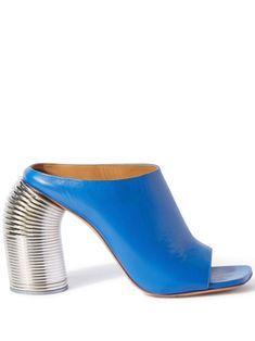 Step into the new season with these stunning leather mules from Off-White. In a striking cobalt blue with a shimmering silver tone, these open-toe slip-ons are the epitome of luxury and style. The standout feature? A uniquely designed cylindrical heel that resembles the iconic Slinky toy - a bold and playful twist that will make you the center of attention wherever you go. Crafted from high-quality leather Eye-catching cobalt blue with silver tone Open-toe slip-on style Branded heel counter Uniq Blue Leather Flats, White Runway, Spring Heels, Dream Fashion, Off White Shoes, High Heel Mules, On Logo, Heel Mules, Leather Sandals Flat